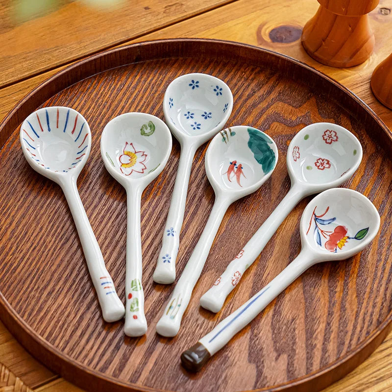 A group of ceramic kawaii spoons on the table