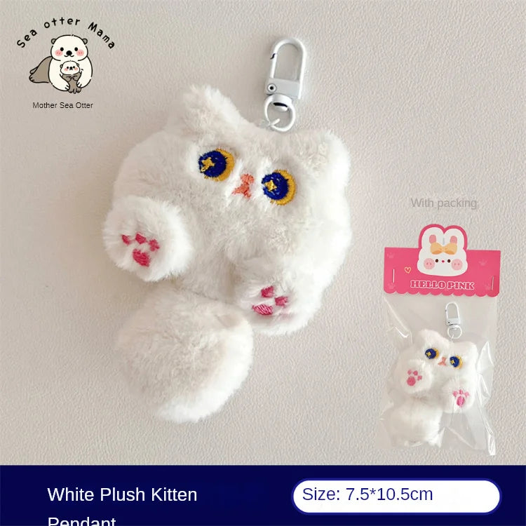 White kawaii plush kitten pendant with a carabiner on a light gray background