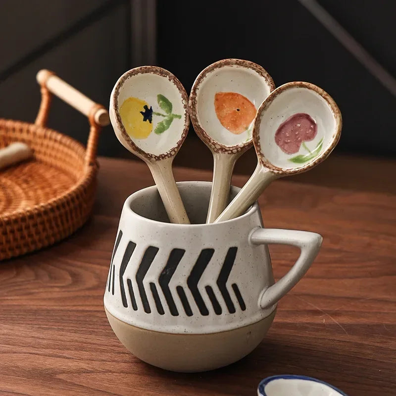 Three ceramic kawaii spoons inside a mug