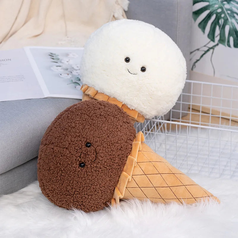 Kawaii plush toy resembling an ice cream cone with a smiling face on a soft surface.