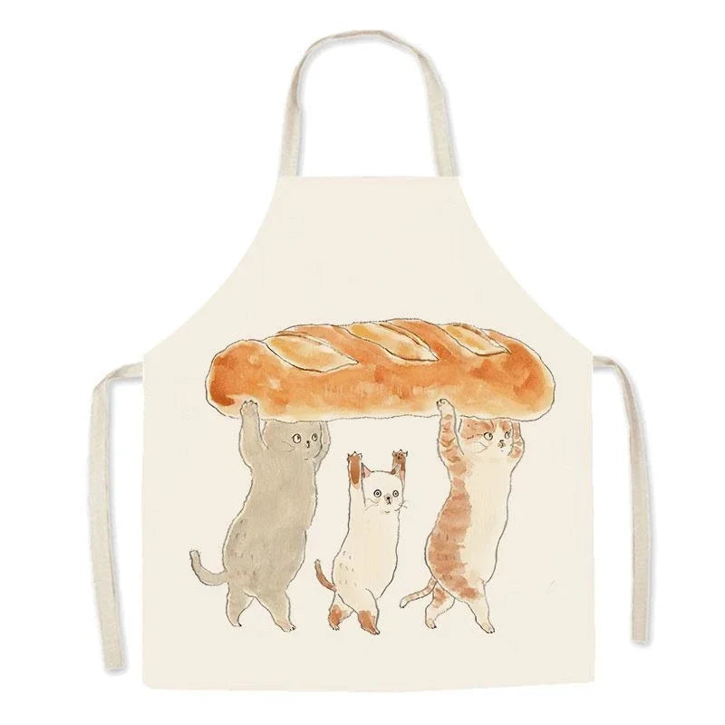 Kawaii apron with cartoon cats holding a loaf of bread on a white background