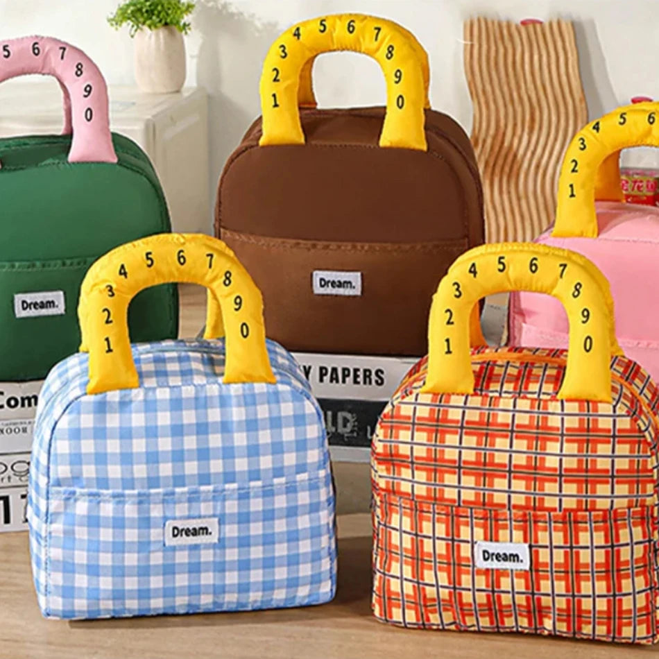 Set of colorful kawaii bags with number handles on a wooden surface.