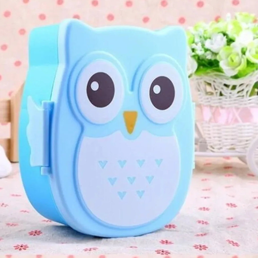 Blue owl-shaped kawaii food container on a polka dot background