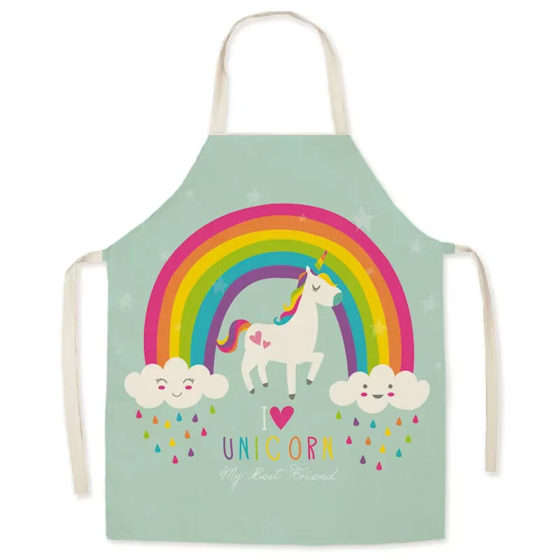 Children's kawaii apron with a unicorn and rainbow design on a light green background