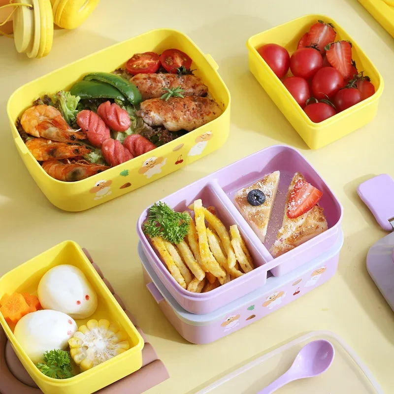 Colorful kawaii bento boxes with various food items on a yellow surface
