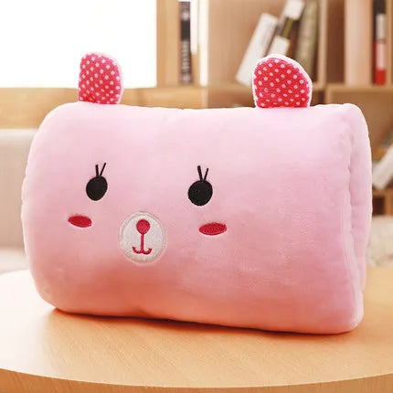 Pink plush kawaii pillow with cartoon face and ears on a wooden surface