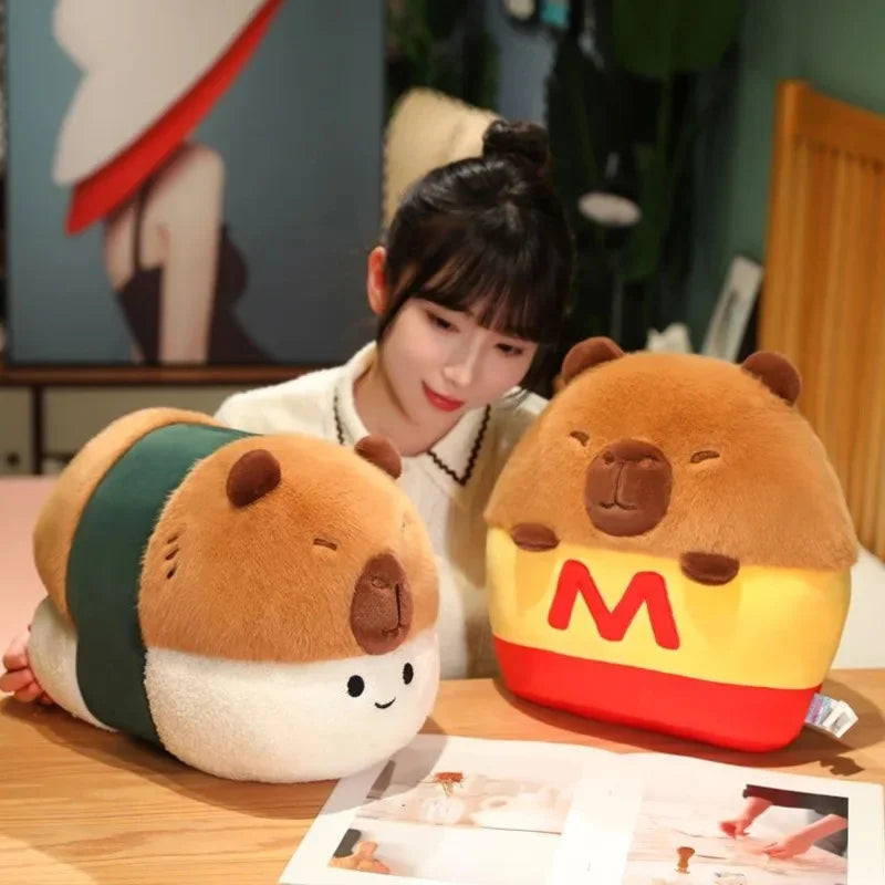 Person sitting at a table with two bear-shaped kawaii plush toys, one resembling sushi and the other resembling a McDonald's logo.