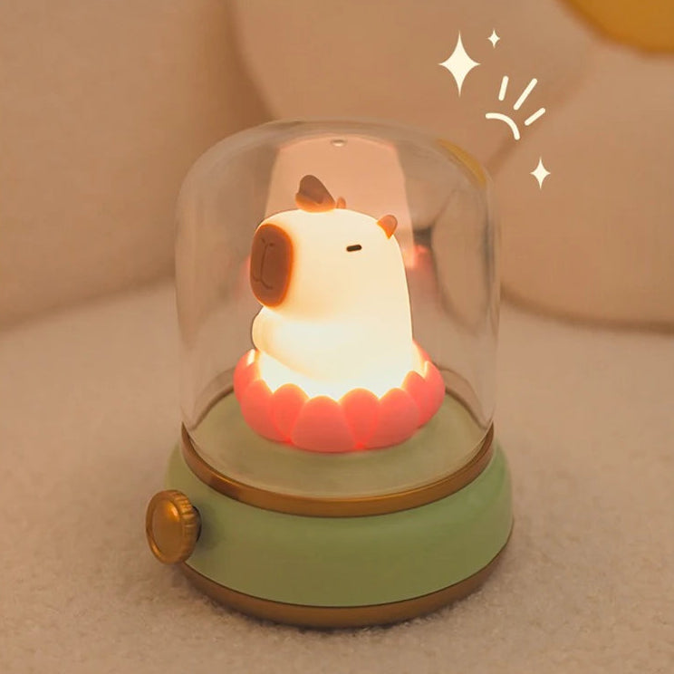 Light-up kawaii dog toy with a glass dome on a beige background