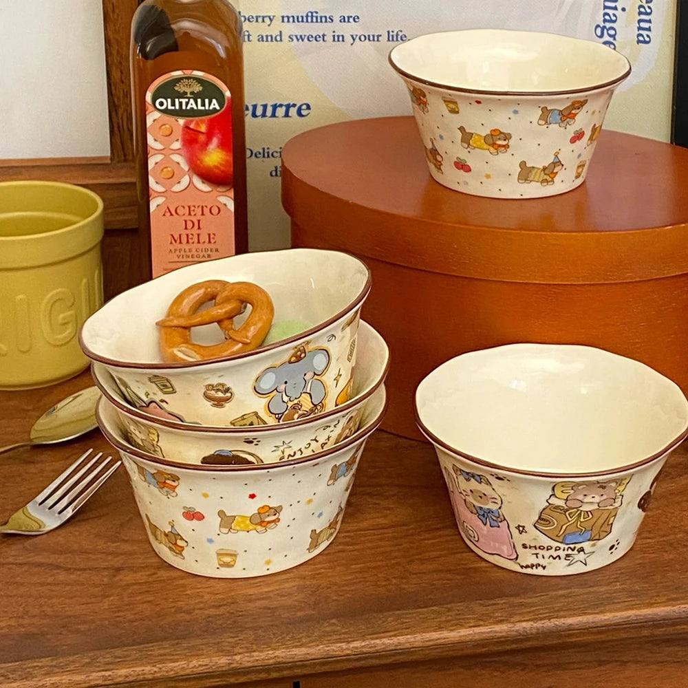 Set of ceramic kawaii ramen bowls with animal patterns on a wooden surface, with a bottle of olive oil in the background.