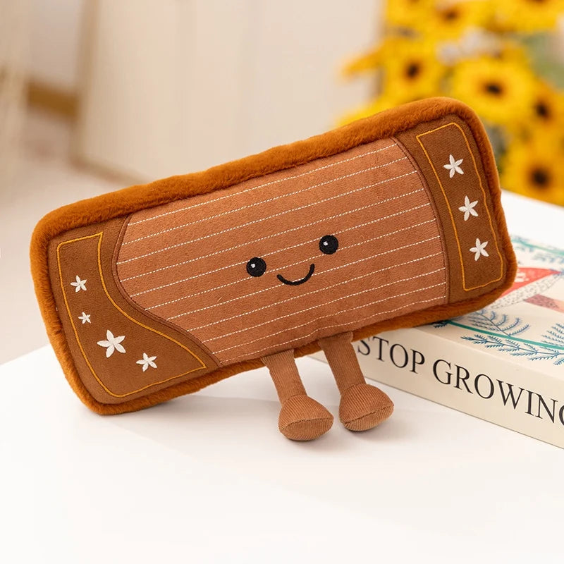 Kawaii plush toy resembling a brown rectangular object with legs and a face on a white surface.