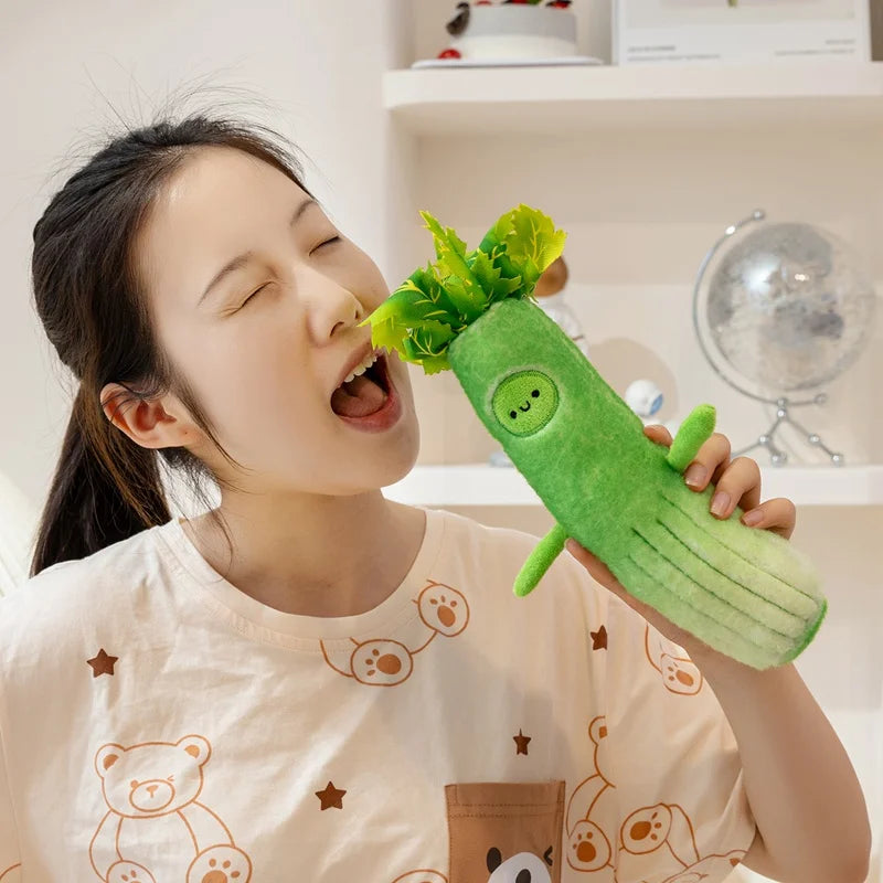 Person holding a green kawaii plush carrot toy
