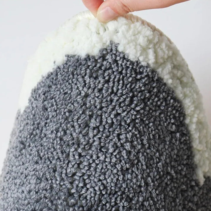Close-up of a textured gray and white kawaii rug