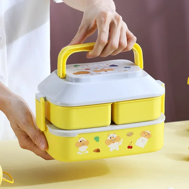 Yellow kawaii lunch box with cartoon designs held by a person on a light background